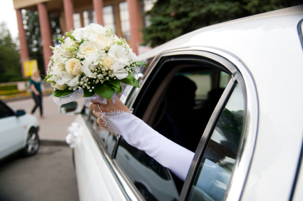 Bride and groom in a limo